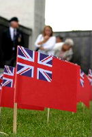 small red ensign planted in lawn